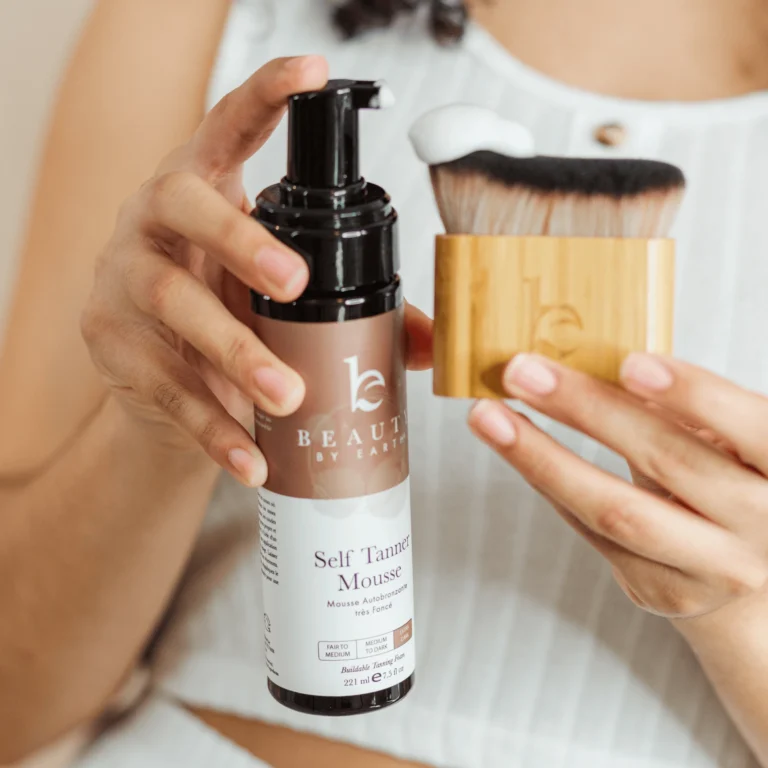 A woman using a self-tanner at home with a professional product