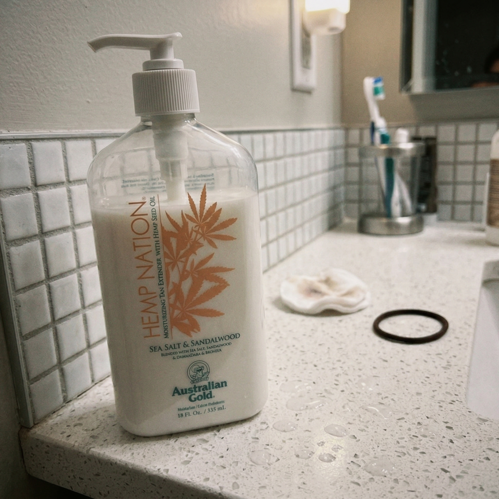 Hemp Nation tan extender bottle on bathroom counter with water drops