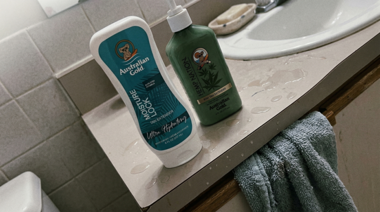 Tan extender lotion next to regular moisturizer on bathroom counter